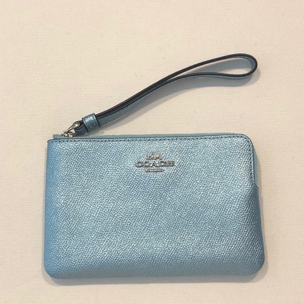 Unused Coach wristlet in metallic sky blue